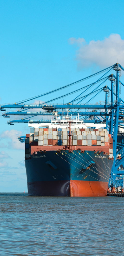a large cargo ship at a dock